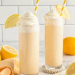Glass of Copycat Chick-fil-A Frosted Lemonade with whipped cream