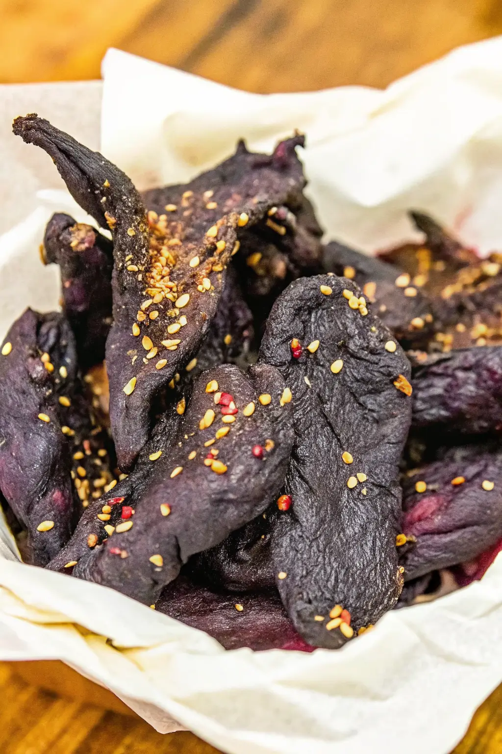 Homemade venison jerky slices arranged on a wooden board