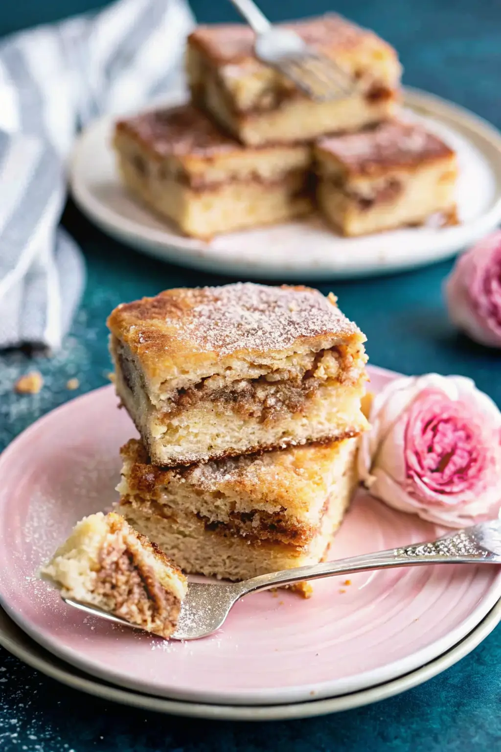 Homemade churro cake topped with cinnamon sugar and caramel drizzle