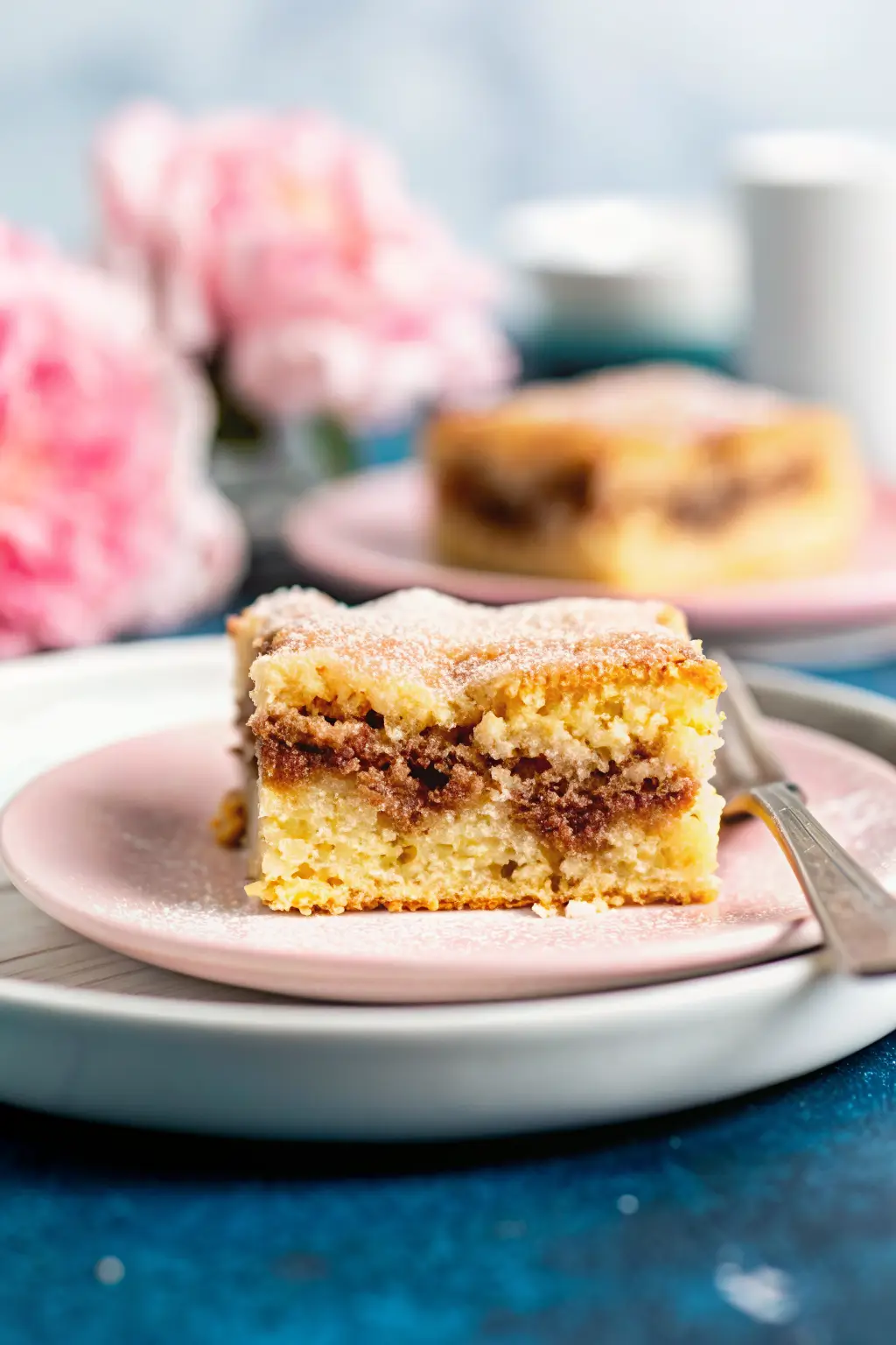 Sliced churro cake on a plate with caramel drizzle