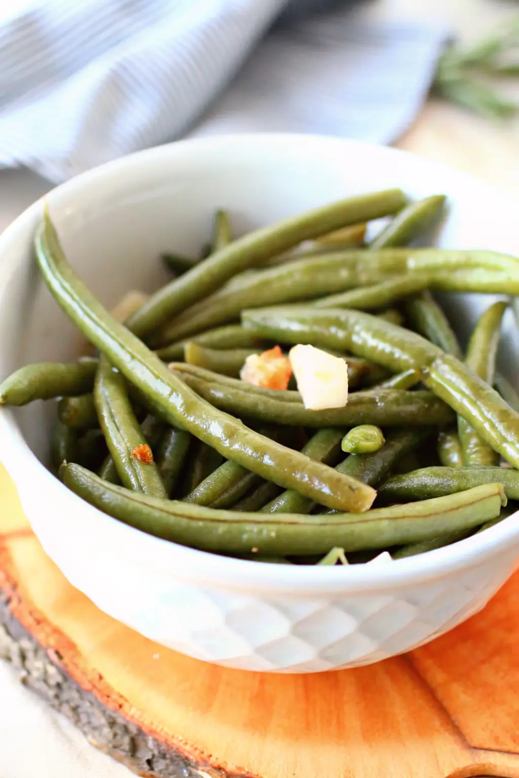 Crockpot Green Beans served in a bowl with onions