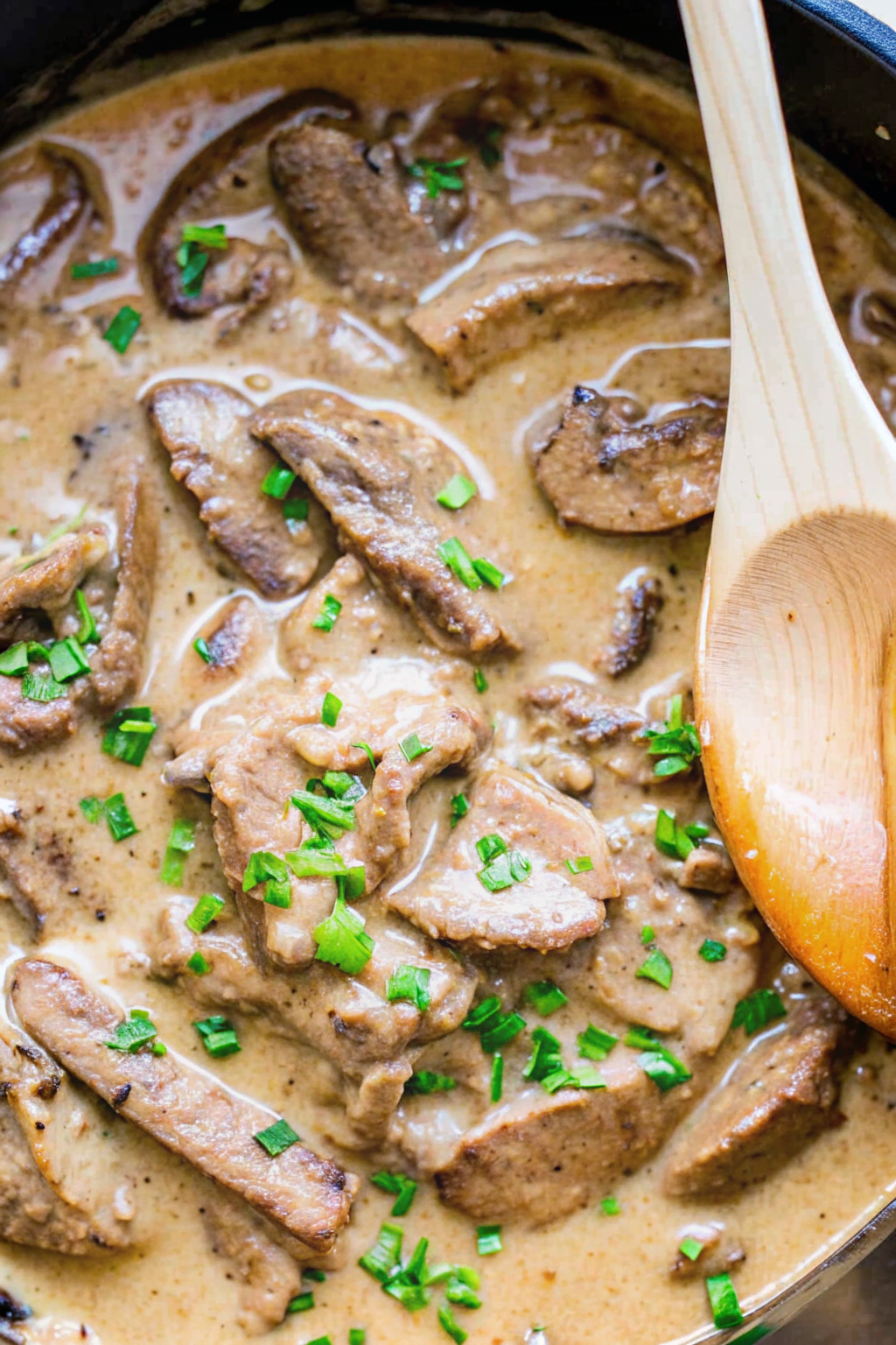 A bowl of creamy Beef Stroganoff served over egg noodles