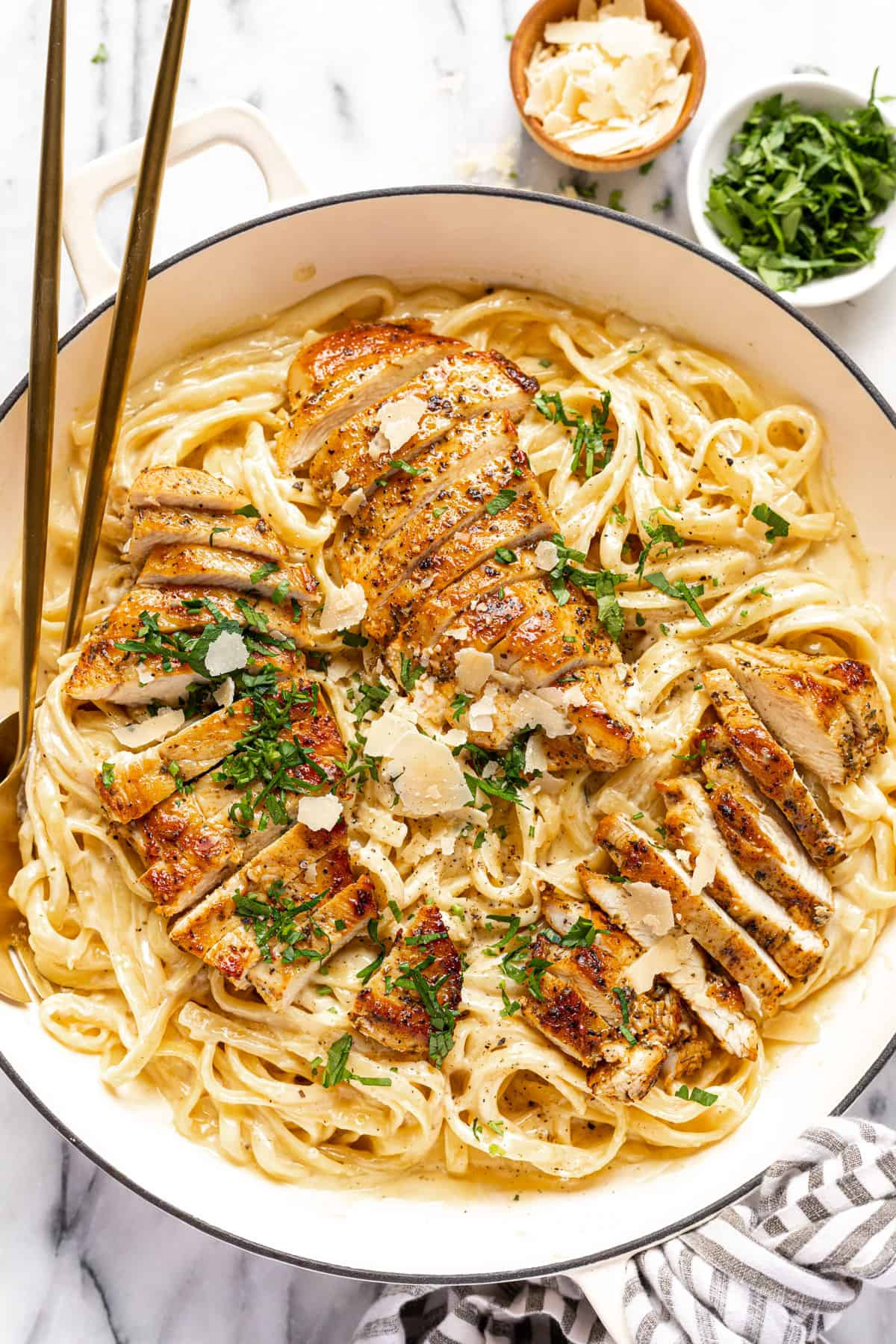Golden brown chicken thighs searing in a cast iron skillet