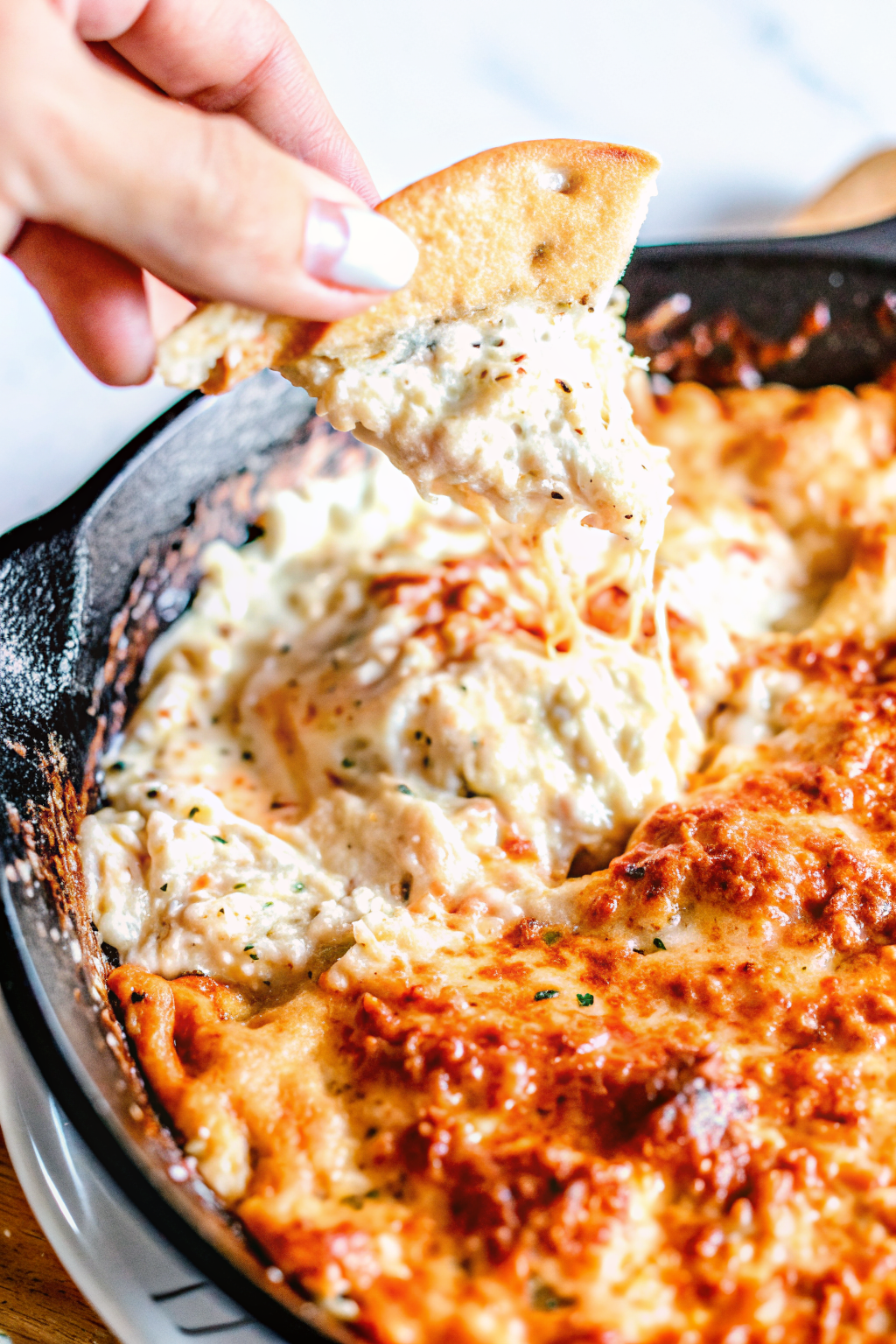 Folding lump crab meat into cream cheese mixture.