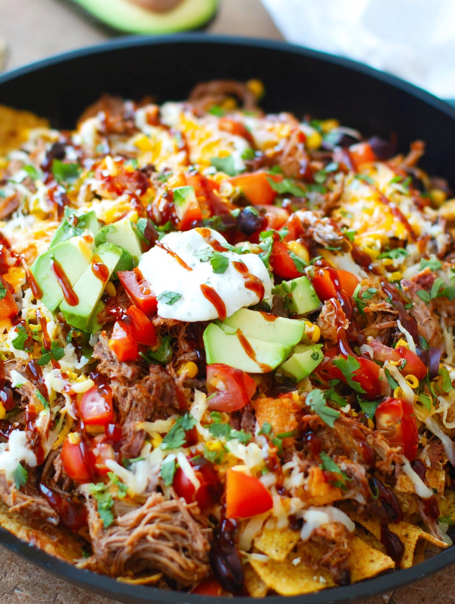 Shredding tender pork shoulder inside an Instant Pot with two forks