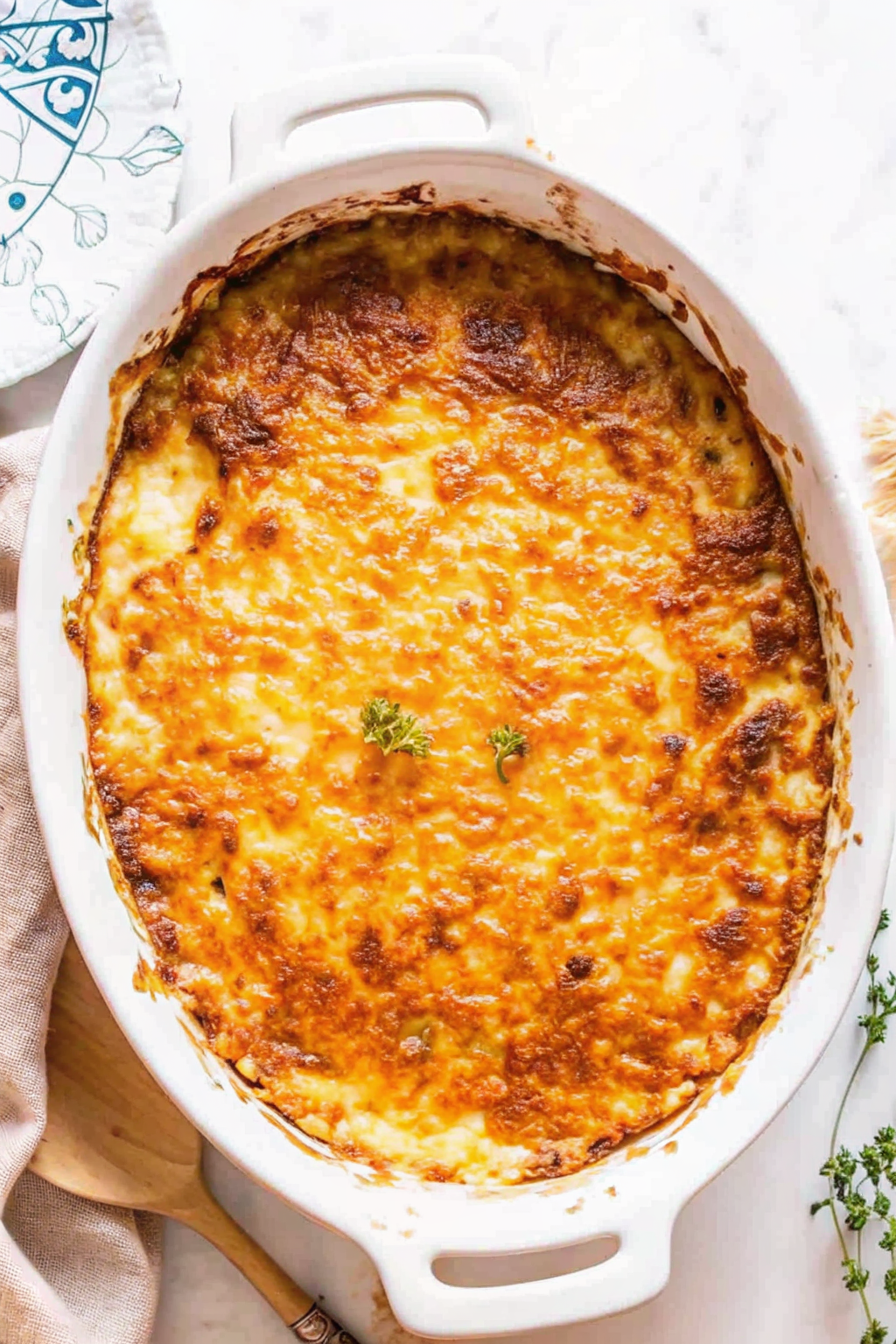 Slicing potatoes thinly on a mandoline for potato gratin