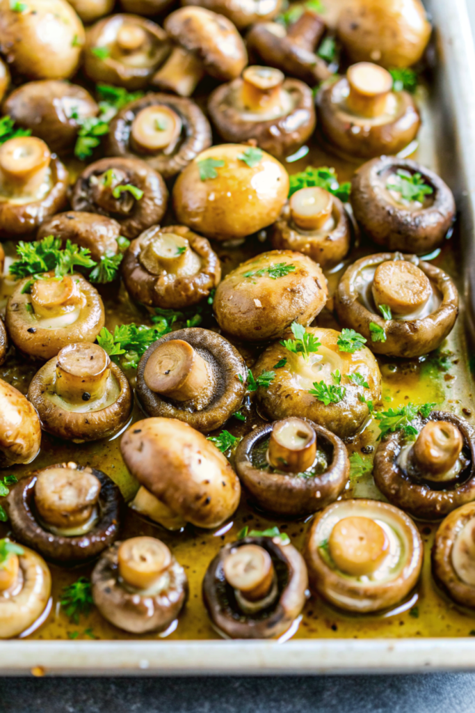 A bowl of hot roasted mushrooms garnished with fresh parsley